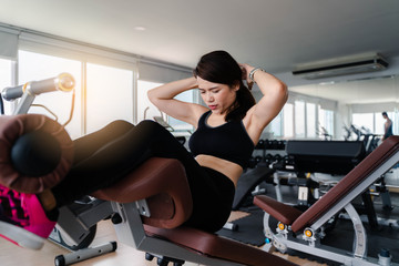 Fototapeta na wymiar Young asia woman workout in gym healthy lifestyle
