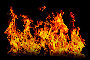 Fire flame isolated on black isolated background - Beautiful yellow, orange and red and red blaze...