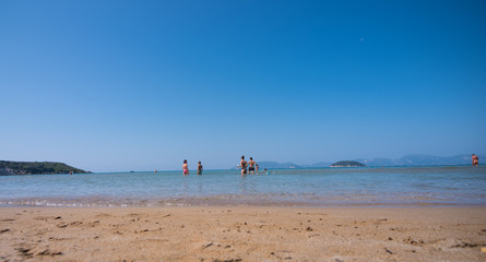 Fototapeta premium People looking into the sea.