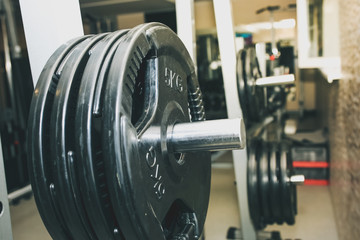 Heavy dumbbells lying in the raw in the gym. Fitness sport motivation. Happy healthy lifestyle living. Exercises with bars weights.