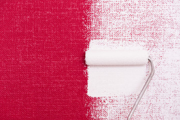 Obraz premium Tools for coloring, paint roller, brush, aluminium leader. Wall partly collored.