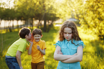 Little girl offended after quarrel to his brothers. - obrazy, fototapety, plakaty