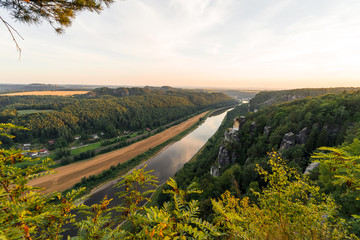 Landscapes of Saxon Switzerland - is the German part of Elbe Sandstone Mountains. Sunset over the valley of the river Elbe.