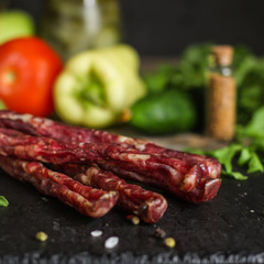 meat smoked jerky - raw meat sausage meat. food background. top view and copy space
