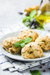 Oven baked salmon patties with herbs. Selective focus, space for text.