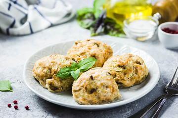 Oven baked salmon patties with herbs. Selective focus, space for text.