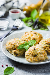 Oven baked salmon patties with herbs. Selective focus, space for text.
