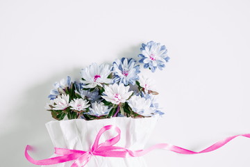 Floral composition. Bouquet made of fresh flowers on light pastel background. Flat lay, top view, copy space 