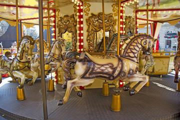 Fototapeta na wymiar Old fashioned french carousel with horses