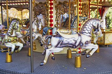 Old fashioned french carousel with horses