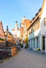 Marcus Tower with fountain and Roderbogen arch, street in Rothenburg ob der Tauber, Germany