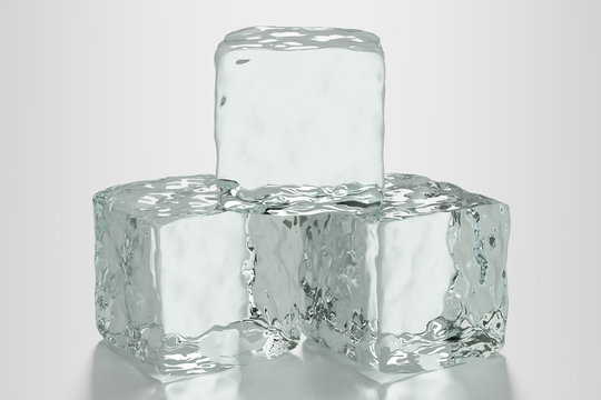 Three ice cubes on clean surface