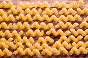 Pasta raw on wooden background