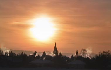 Obraz premium Colorful winter sunrise over village