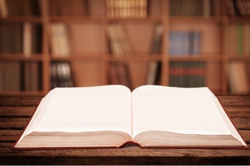 Open book on old wooden table