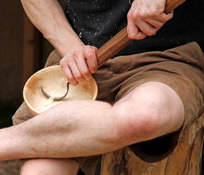 A Carpenter Carving Out the Inside of a Wooden Bowl.