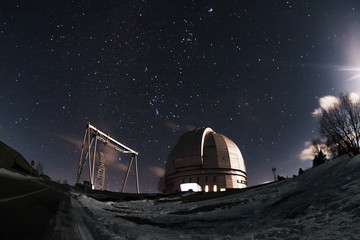 The view of the telescope BTA on a dark background of a starry sky. Arkhyz. Night astrophotography....