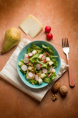 salad with cheese pear radish lettuce and nuts