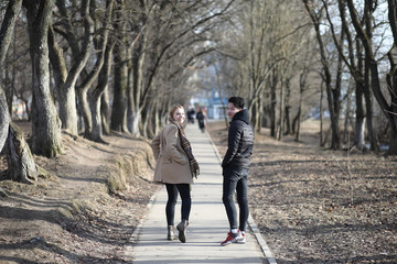 A couple of friends are sitting on the steps