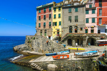 View on the beautiful colourful houses and the floating fishing boats in the harbour of Cinque Terre, Italy. © Spectral-Design