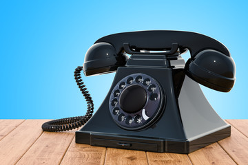 Retro telephone on the wooden table, 3D rendering