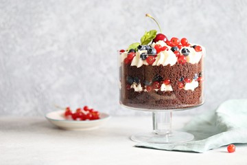 Chocolate and berrie trifle. Layered chocolate dessert with fresh seasonal berries and whipped cream.