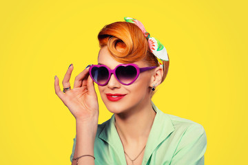 pinup girl woman holding heart shaped sunglasses