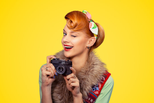 Photographer. Woman smiling, holding camera.