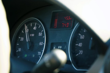 Photo speedometer in the car on the dashboard