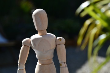 figurine alone in garden