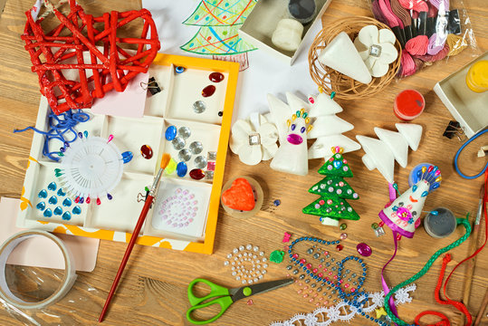 Handmade decorations for new year and other holidays. Artwork workplace with creative accessories.