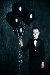  holding black balloons © Andrey Kiselev