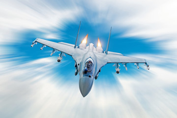 Combat fighter jet on a military mission with weapons - rockets, bombs, weapons on wings, at high...