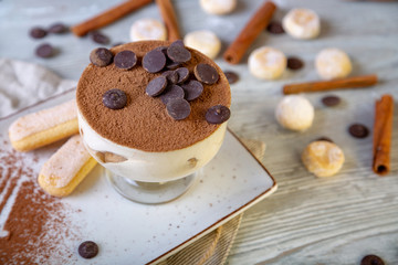 Close up view of beautiful elegant sweet dessert served on the plate. Beautiful decoration, restaurant dish, ready to eat. Tea time, cozy atmosphere.