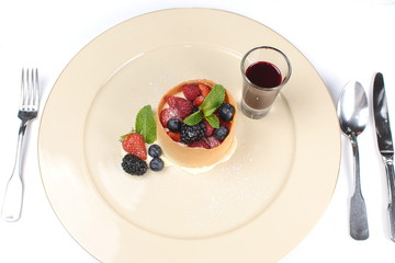 dessert with fruit and berry sauce