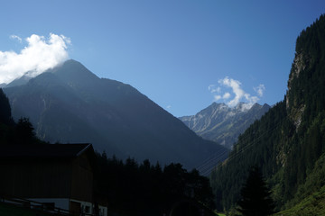 Mountains in the fog photographed on a pass road in Austria in autumn
