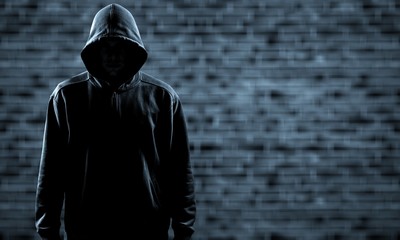 Thief in black clothes on grey background - obrazy, fototapety, plakaty