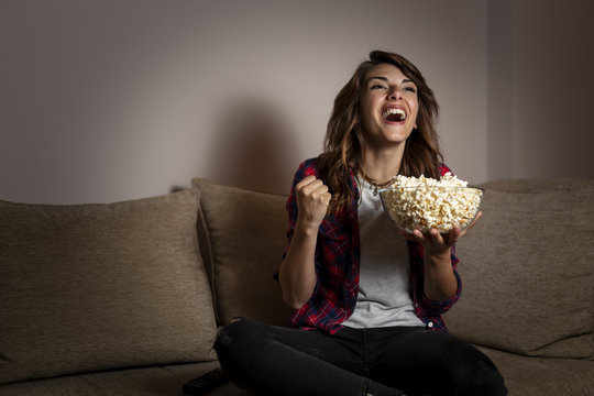 Woman Watching A Football Match On TV