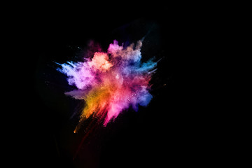 abstract colored dust explosion on a black background.abstract powder splatted background,Freeze...