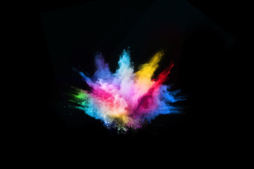 abstract colored dust explosion on a black background.abstract powder splatted background,Freeze...