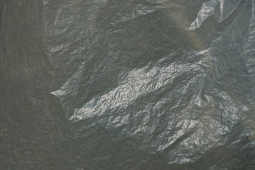 gray white plastic texture of a piece of crumpled cellophane