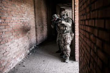 Soldiers in camouflage stormed the building while indoors