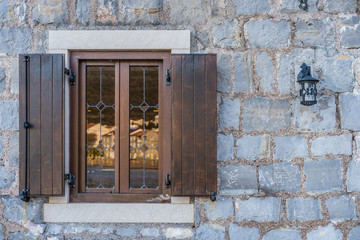 Fototapeta na wymiar Small wooden window and shutters