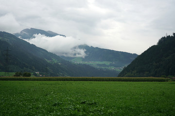 Mountains in the fog photographed on a pass road in Austria in autumn
