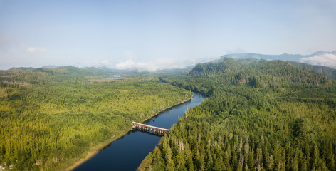 Aerial panoramic landscape view of Kennedy Lake during a cloudy summer day. Taken near Tofino and Ucluelet, Vancouver Island, BC, Canada.