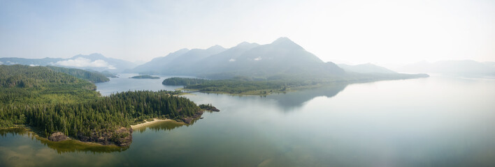 Aerial panoramic landscape view of Kennedy Lake during a cloudy summer day. Taken near Tofino and...