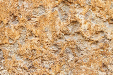 stony uneven brown-yellow texture with scratches and sand