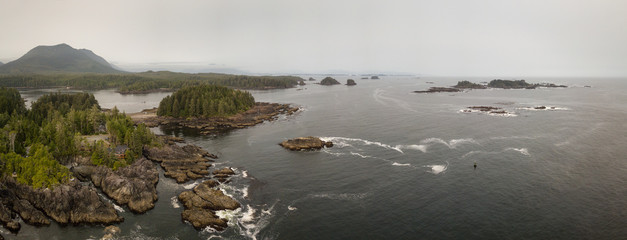 Aerial panoramic seascape view of the Pacific Ocean Coast during a cloudy summer day. Taken in Ucluelet, Vancouver Island, BC, Canada.