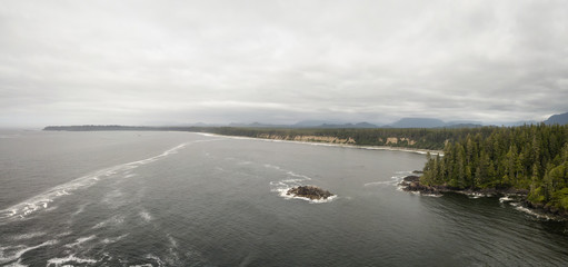 Aerial panoramic seascape view of the Pacific Ocean Coast during a cloudy summer day. Taken near Tofino and Ucluelet, Vancouver Island, BC, Canada.