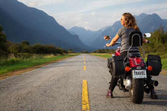 Woman Riding A Motorcycle On A Scenic Road Surrounded By Canadian Mountains. Taken In Pitt Meadows, Greater Vancouver, BC, Canada.